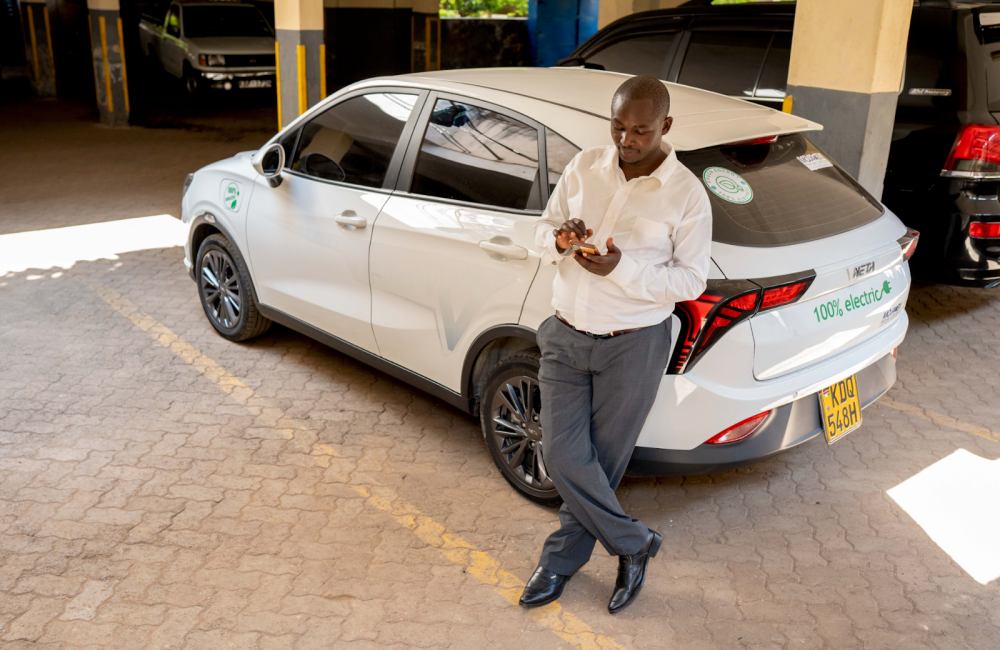 Paul Mwai responding to a taxi ride request. He switched from a petrol-fueled car to a Chinese EV which he said gives him better returns since he is no longer spending money on fuel. Photo / CGSP