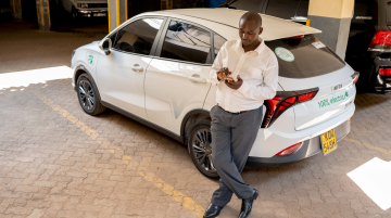 Paul Mwai responding to a taxi ride request. He switched from a petrol-fueled car to a Chinese EV which he said gives him better returns since he is no longer spending money on fuel. Photo / CGSP