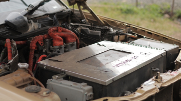 Joe Gakuru, Founder and CEO of QTron Industries in Kenya, which retrofits classic cars into EVs, during the interview in his garage outside Nairobi. He relies on Chinese tech for most of the cars and bikes as well as battery energy storage. Photo / CGSP