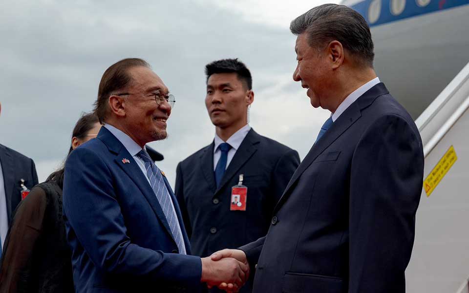 Malaysian PM Anwar Ibrahim warned against "economic tribalism" in a veiled swing to Washington, praising Xi Jinping's conduct as a model of steadiness.