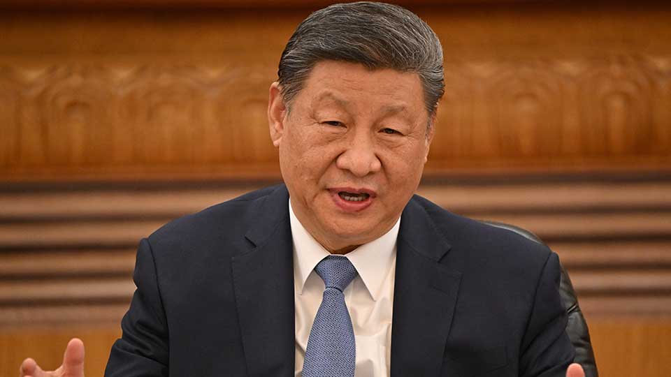 Chinese President Xi Jinping urged China and Vietnam on Monday to "be impervious to all interference" in managing their maritime disputes.
