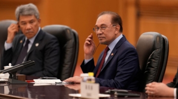 China backs Malaysia’s BRICS membership, Laos weighs entry.