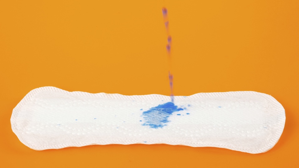 Purple liquid being absorbed by a sanitary pad. There is mounting anger in Senegal against Softcare, a subsidiary of the Chinese group Sunda International over the alleged use of expired materials in sanitary pads and diapers. Photo / FOTOGRAV DI ANTONIO GRAVANTE/SCI / AGV / Science Photo Library / AFP