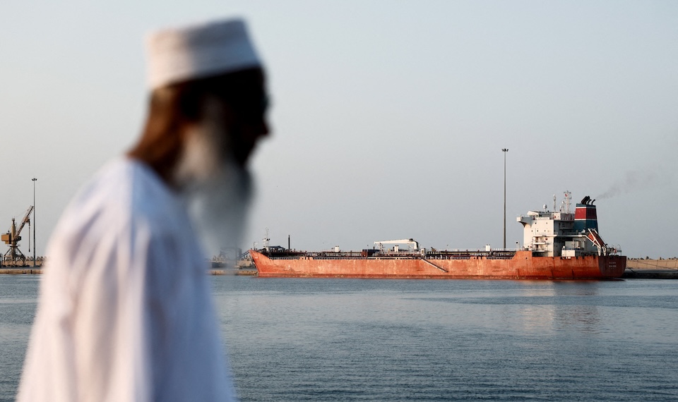 A Callisto tanker is anchored in Port Sultan Qaboos as the traffic is down in the Strait of Hormuz. The U.S.-Israeli attacks on Iran could accelerate the EV sector in different African countries if oil shortages become a reality or retreat if EVs remain out of reach of many. REUTERS/Benoit Tessier