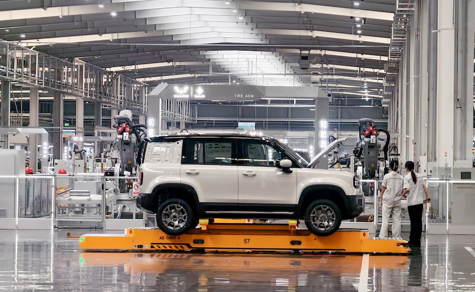 Workers assemble cars in the production workshop of SAIC GM Wuling Baojun Base in Liuzhou, Guangxi, China, on September 8, 2025. (Photo by Costfoto/NurPhoto) (Photo by CFOTO / NurPhoto via AFP)
