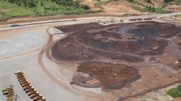 An aerial view of iron ore stockpiles at the SimFer mining complex in the Simandou mountain range in the Nzerekore region, on September 2, 2025. The Simandou mining project is expected to start iron ore production in November 2025, almost 30 years after explorations began in the Simandou mountain range. (Photo by PATRICK MEINHARDT / AFP)