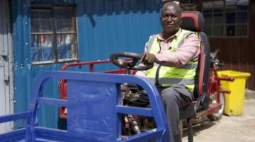 Geoffrey Gĩtaũ poses with the e-mkoko, which uses a unique swivel mechanism without duplicating operating tools like the brakes and the accelerator. The vehicle was inspired by a farmer’s need to transport equipment and farm produce in Embu, Kenya. Photo / CGSP
