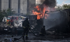 Firefighters work at a site of a Russian drone strike, amid Russia's attack on Ukraine, in Zaporizhzhia, Ukraine May 15, 2026. REUTERS/Stringer