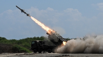 A Japan Ground Self-Defense Force (JGSDF) Type 88 surface-to-ship missile launcher fires during the Joint Task Force (JTF) Maritime Strike, part of Balikatan, the annual joint military exercises between the United States and the Philippines, at Culili Point Sand Dunes, Paoay, Ilocos Norte province, Philippines, May 6, 2026. REUTERS/Noel Celis TPX IMAGES OF THE DAY